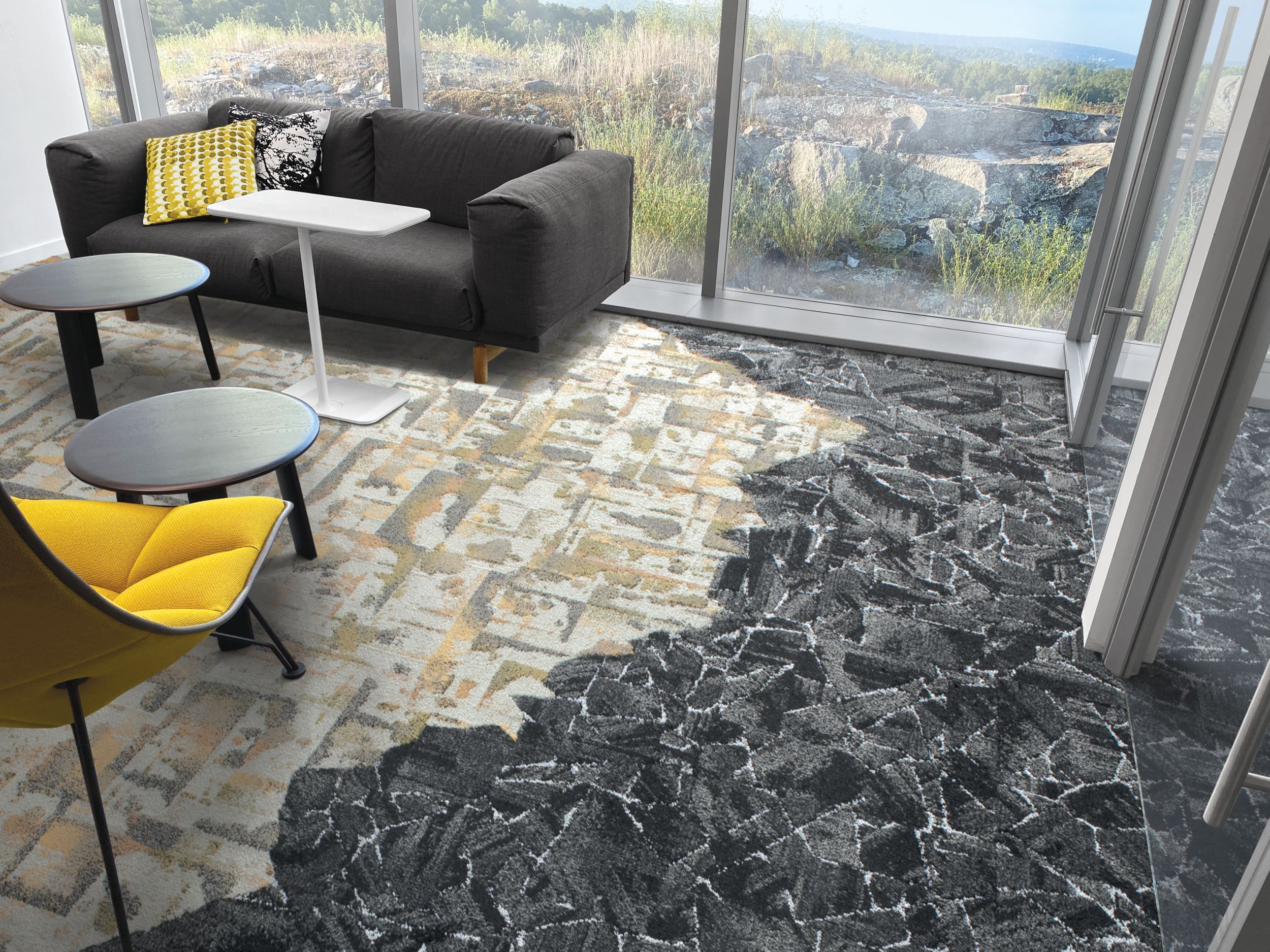 Interface Panola Mountain and Mile Rock carpet tile in small room with black couch and yellow chair imagen número 2